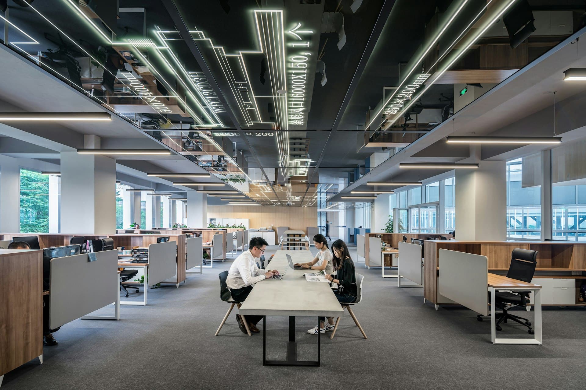 Team reviewing financial work together in a modern office