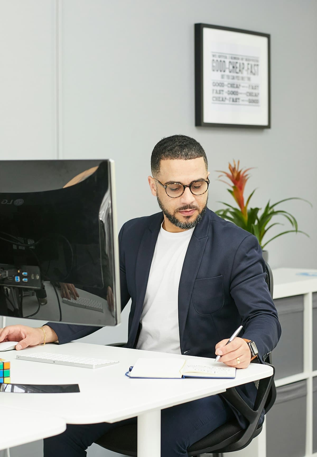 Accountant reviewing notes at a modern office desk